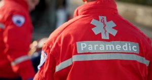 paramedic uniform with Star of Life emblem and Paramedic text visible