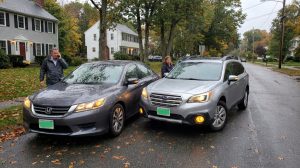 two vehicles involved in rear-end collision on residential street with drivers outside